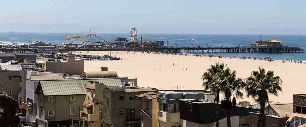 The Strand with the Venice Beach and Boardwalk during a sunny day. 